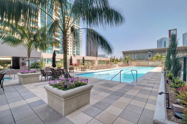 view of pool featuring a patio