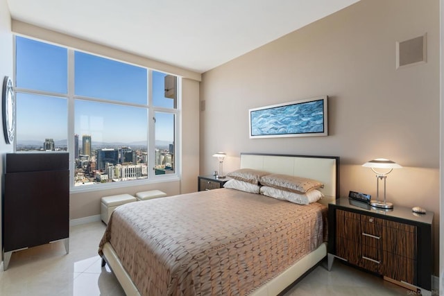 bedroom featuring light tile patterned floors