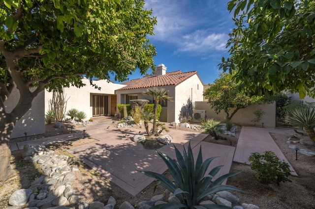 back of property with a patio area