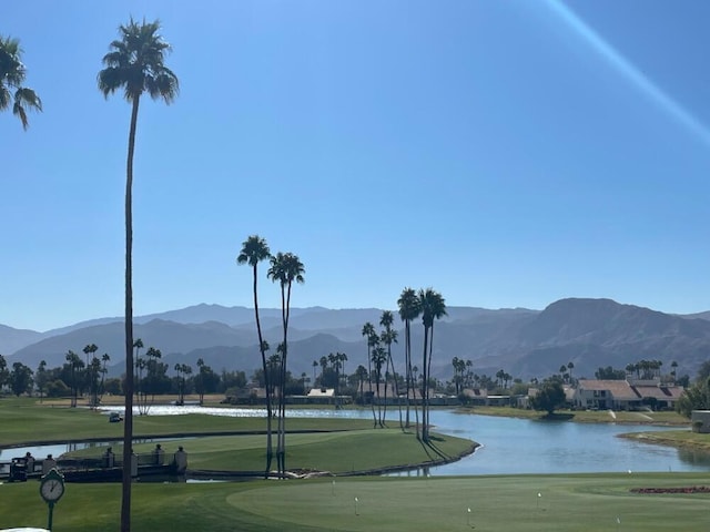 surrounding community featuring a yard and a water and mountain view