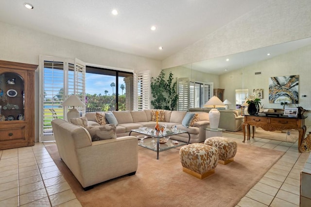 tiled living room with high vaulted ceiling