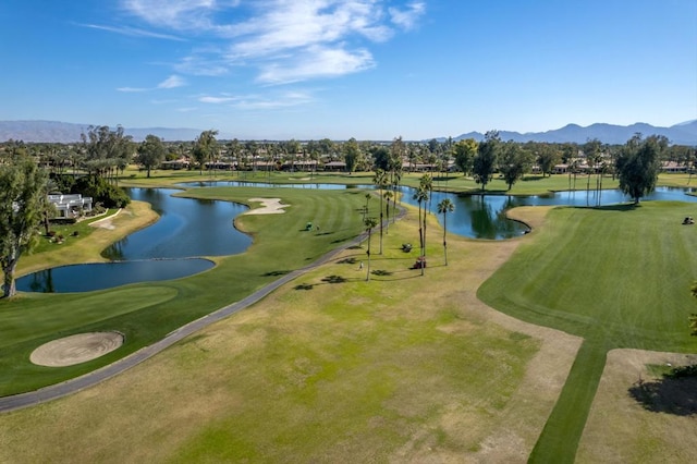 surrounding community with a yard and a water and mountain view