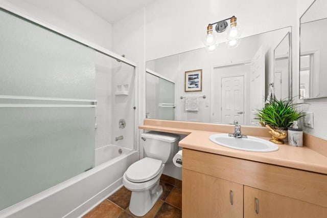 full bathroom with toilet, bath / shower combo with glass door, and vanity