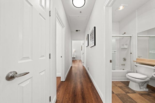 corridor featuring dark wood-type flooring