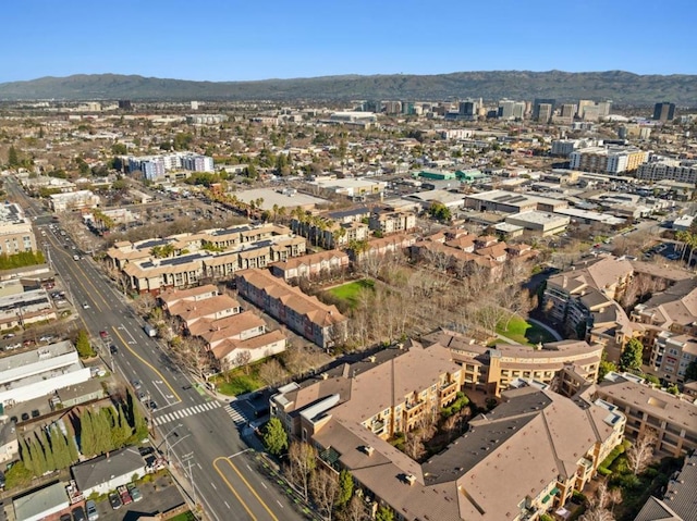 birds eye view of property featuring a mountain view