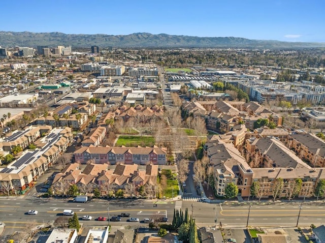 birds eye view of property with a mountain view