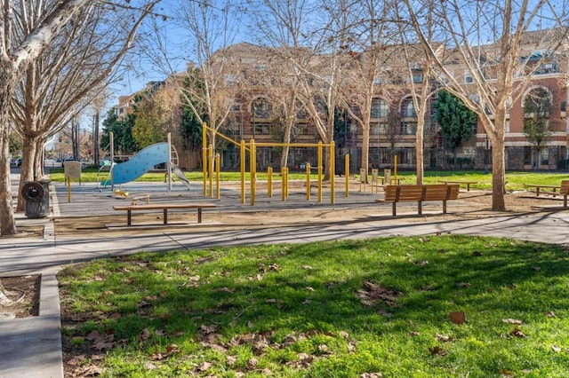 view of community featuring a lawn and a playground