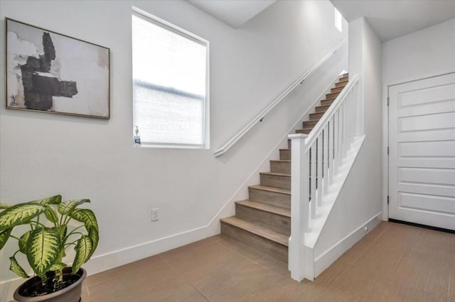 stairs with tile patterned flooring