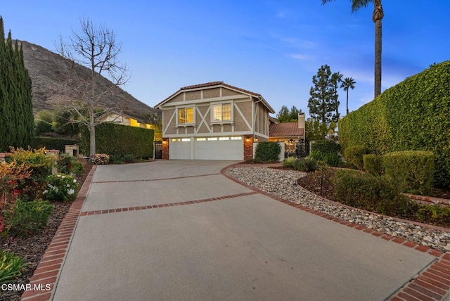 tudor home featuring a garage