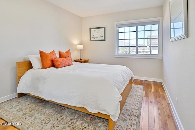 bedroom with wood-type flooring