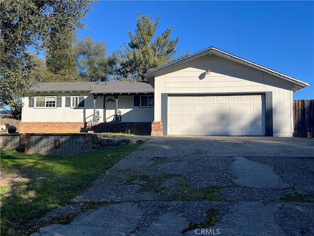 view of front facade featuring a front yard and a garage