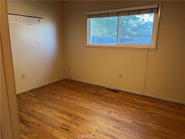 unfurnished room featuring light wood-type flooring