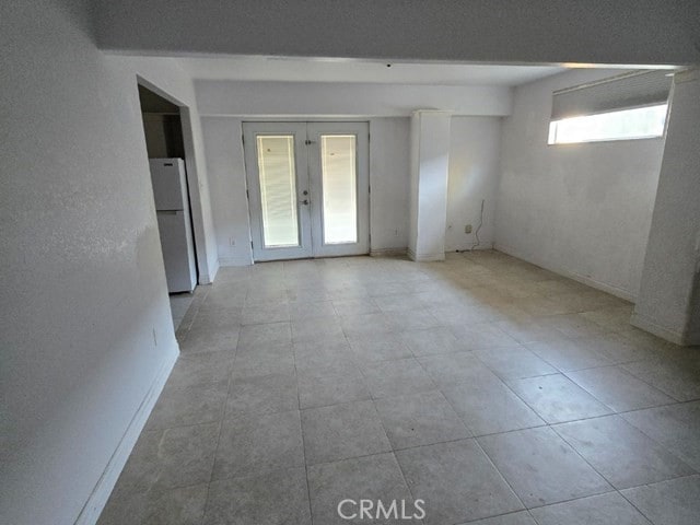 spare room featuring french doors