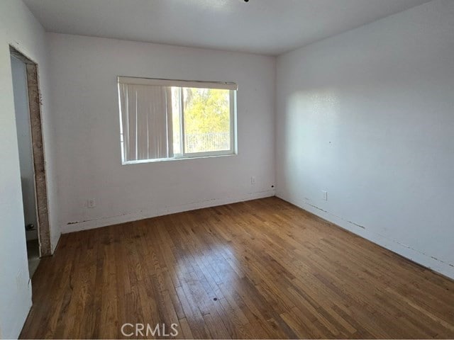 spare room featuring hardwood / wood-style flooring