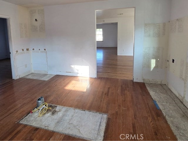 empty room with dark wood-type flooring