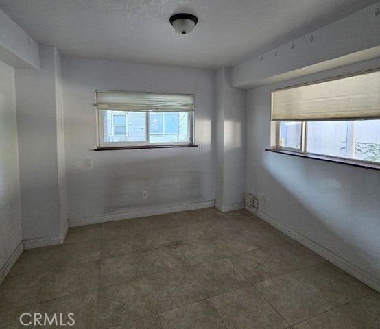 spare room featuring a wealth of natural light