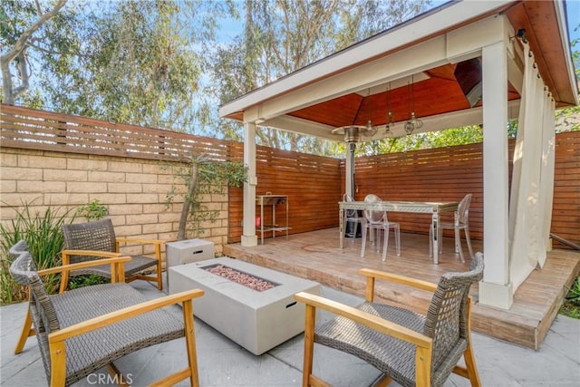 view of patio / terrace featuring an outdoor fire pit and a gazebo