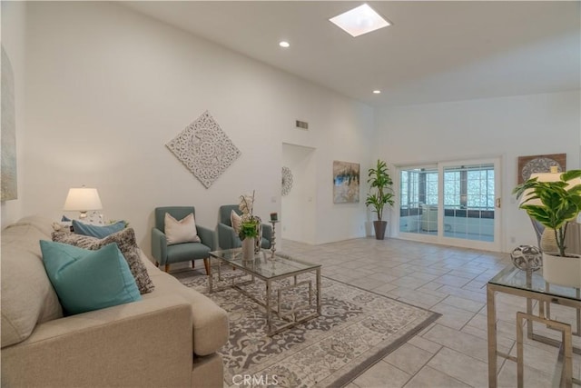 living room with a high ceiling