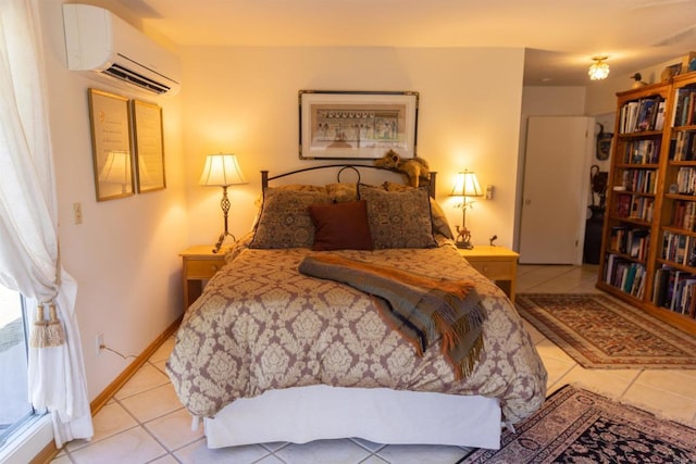 bedroom with light tile patterned floors and an AC wall unit