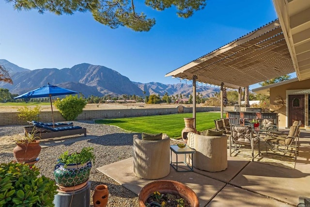 view of patio with a pergola and a mountain view