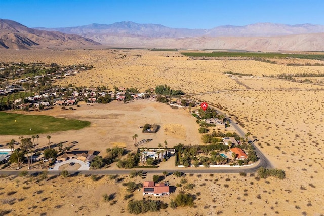 birds eye view of property with a mountain view