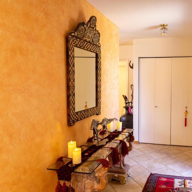 hall with light tile patterned flooring