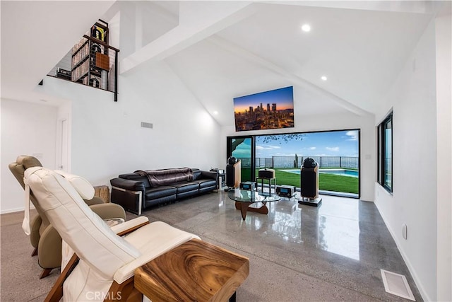 living room with a high ceiling