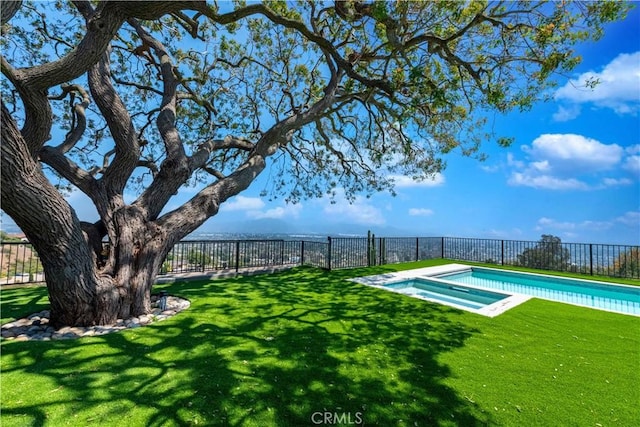 exterior space with a fenced in pool