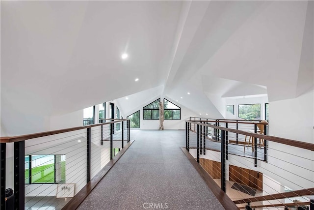 hallway featuring vaulted ceiling