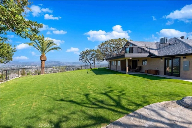 view of yard featuring a mountain view and a patio