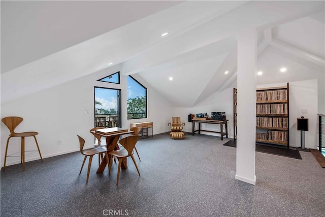 dining space with lofted ceiling with beams