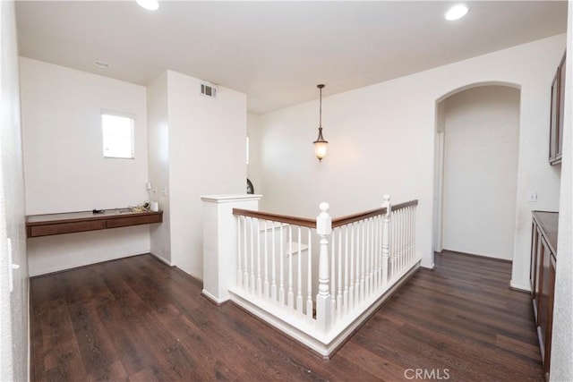 hall with dark hardwood / wood-style flooring