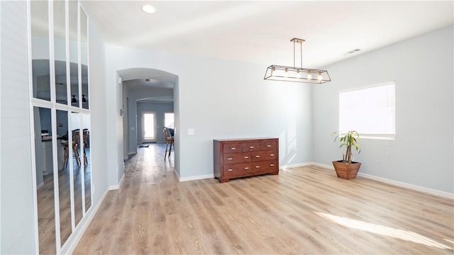 spare room with light hardwood / wood-style floors