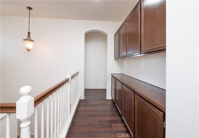 corridor featuring dark hardwood / wood-style flooring