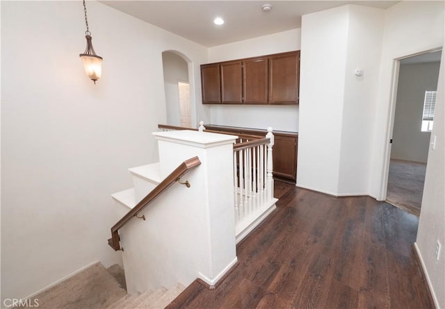 stairs with hardwood / wood-style flooring