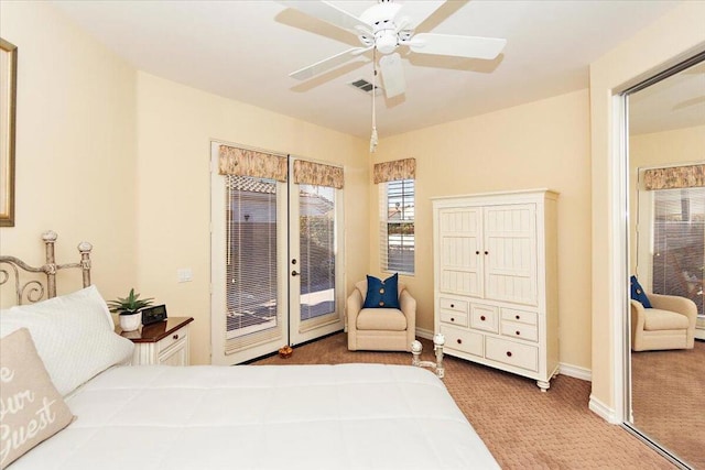 carpeted bedroom with ceiling fan, french doors, and access to outside