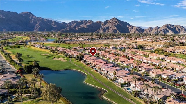 aerial view featuring a water and mountain view