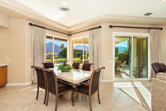 tiled dining room featuring a mountain view