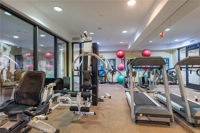 workout area featuring visible vents and recessed lighting