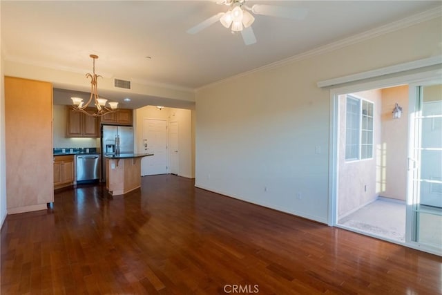 unfurnished living room featuring ornamental molding, visible vents, and dark wood finished floors