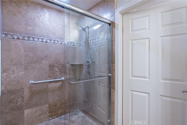 full bathroom with a shower stall