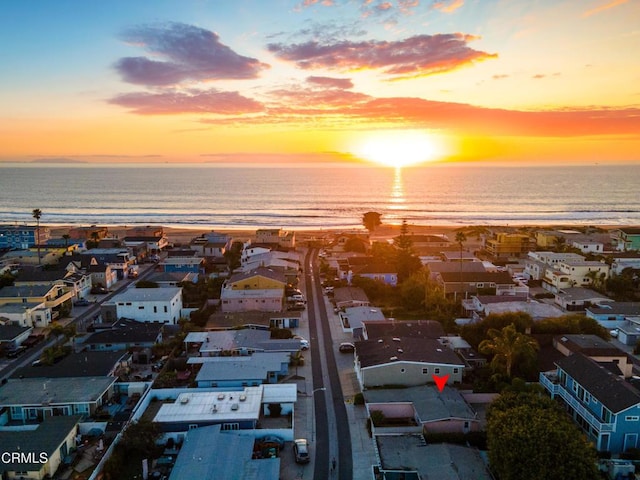 aerial view at dusk with a water view