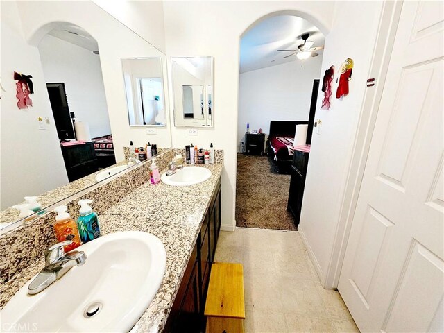 bathroom with ceiling fan and vanity