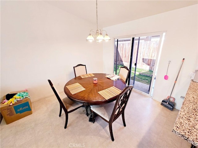 dining space with a chandelier