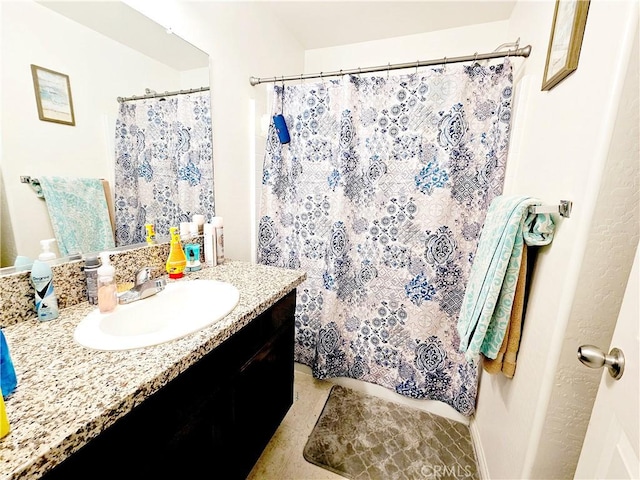 bathroom with vanity, tile patterned flooring, and a shower with curtain