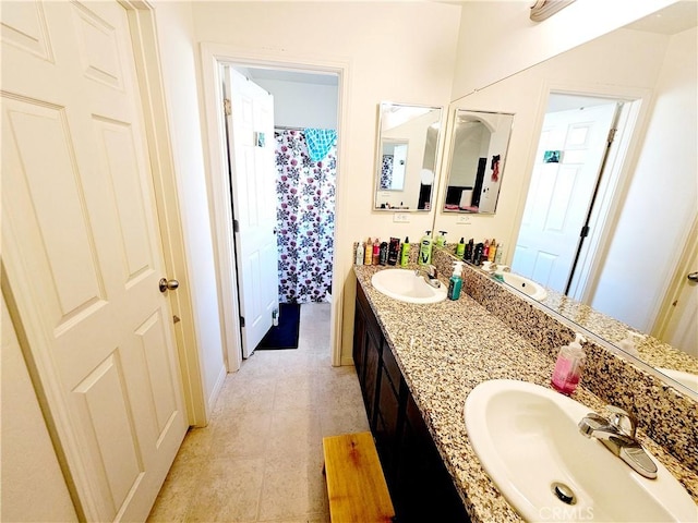 bathroom with tile patterned flooring and vanity