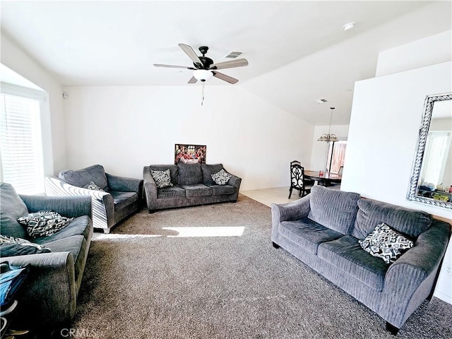 carpeted living room featuring lofted ceiling and ceiling fan