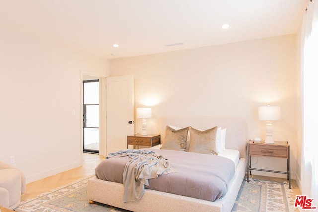 bedroom with wood-type flooring