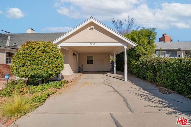 view of front of home featuring a carport