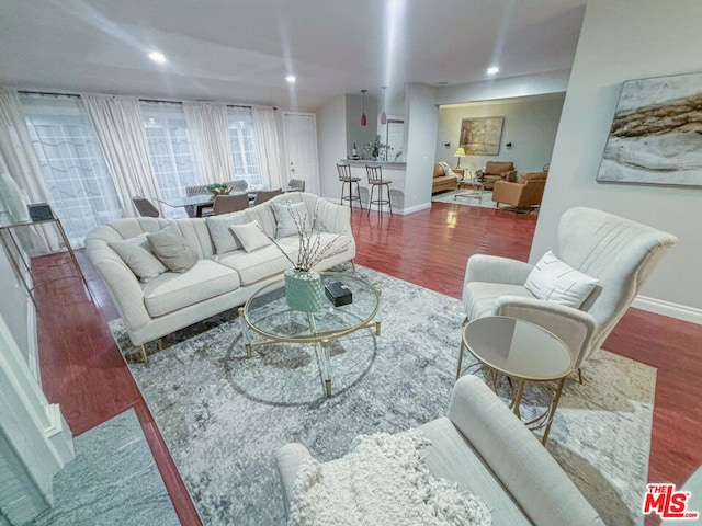 living room featuring dark hardwood / wood-style flooring